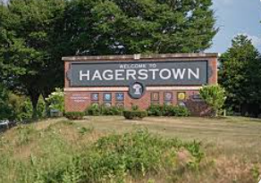 A welcome sign for hagerstown is sitting on top of a grassy hill. A welcome sign for hagerstown is sitting on top of a grassy hill.