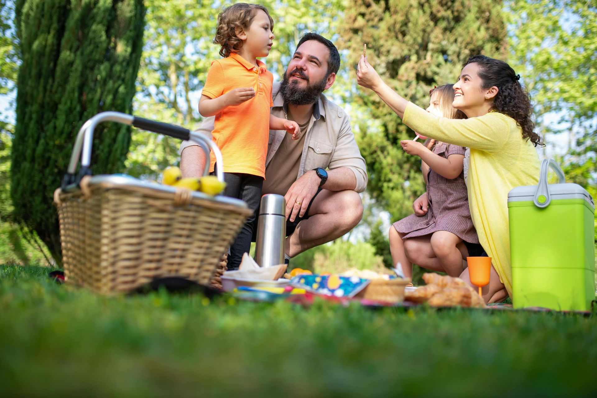 A family is having a picnic in the park.