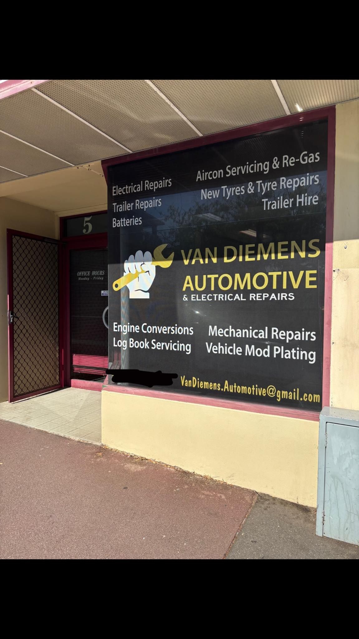 Storefront Window Sign With Service Listings on a Black Background — Van Diemen's Automotive & Electrical Repairs In Bellerive, TAS