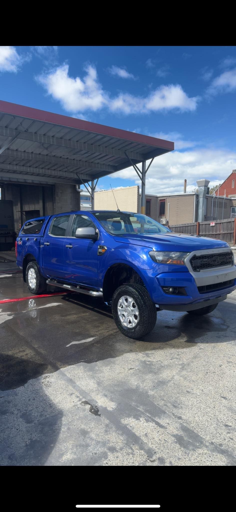 Blue Pickup Truck Parked Under a Carport — Van Diemen's Automotive & Electrical Repairs In Bellerive, TAS