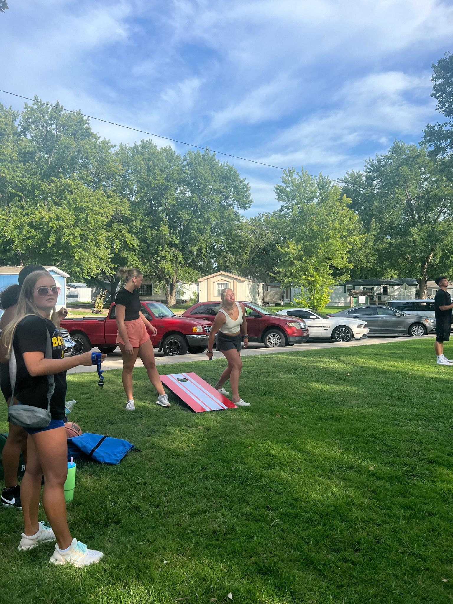 Students play cornhole
