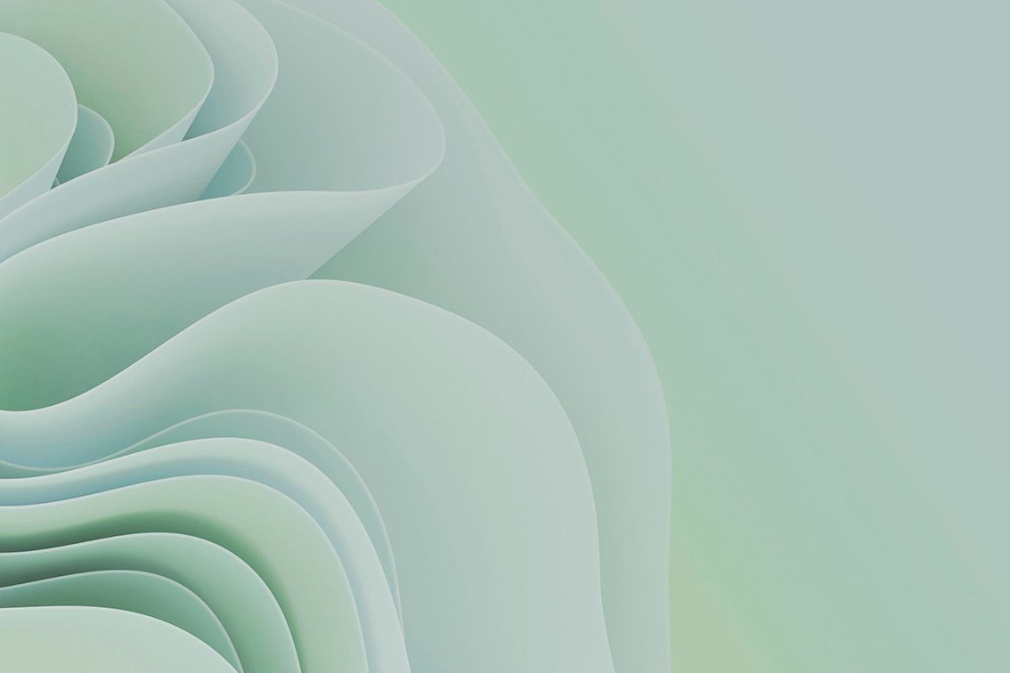 Sfondo astratto a strati, simile alla carta, di un verde tenue con pieghe curve.