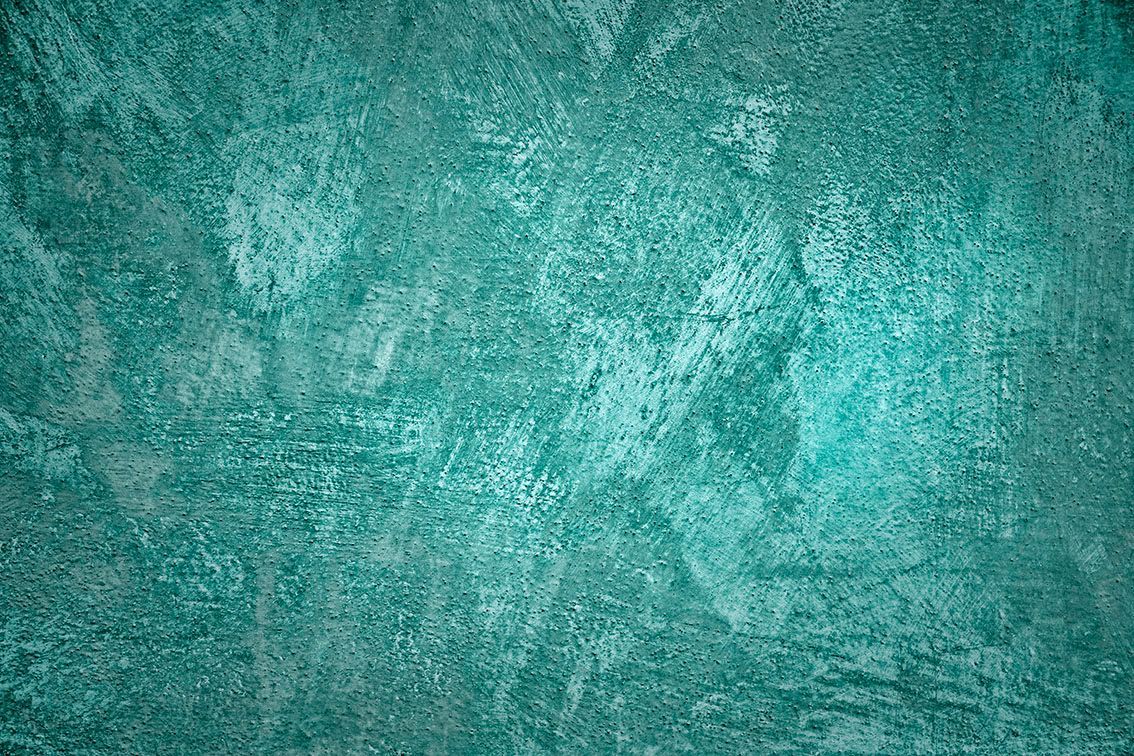 Sfondo astratto color verde acqua con texture e motivi screziati chiari e scuri.