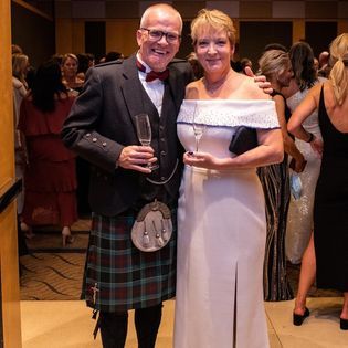 Photo of two people at a wedding. 