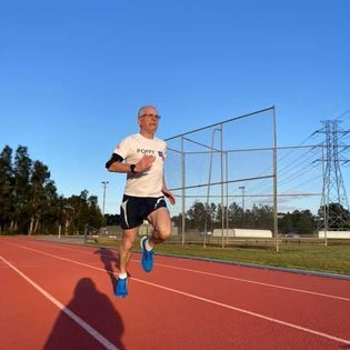 An older man running. 