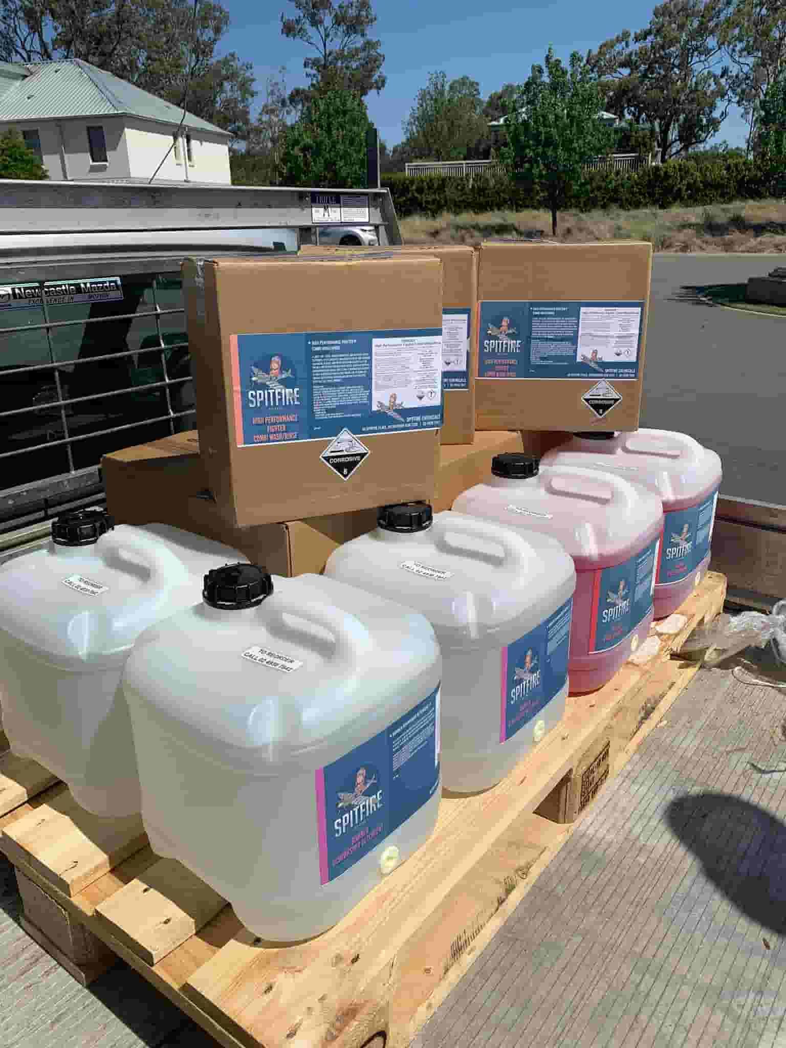 A Wooden Pallet Filled With Bottles and Boxes of Chemicals — Spitfire Chemicals Pty Ltd in Rutherford, NSW