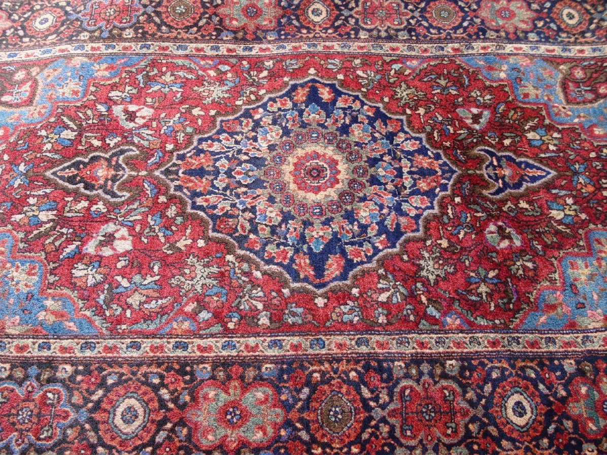 Patterned red and blue Persian oriental rug with a central medallion and ornate border