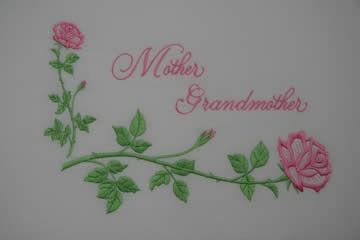 Pink roses with green leaves and stems; text reads