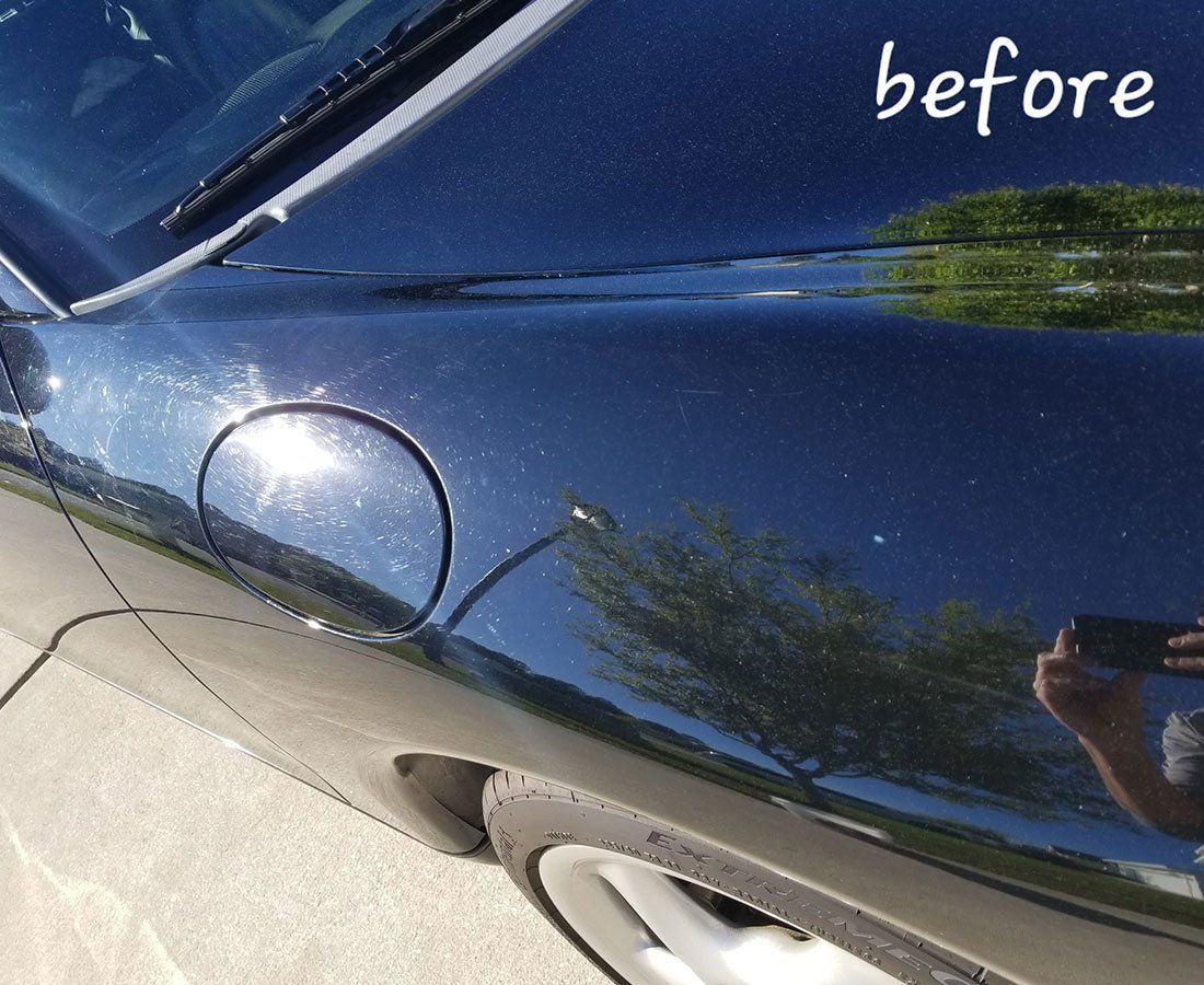 Black car fender with fuel door; 