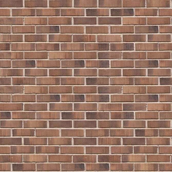 Close-up of a red-brown brick wall with white mortar lines
