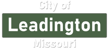 A green sign that says city of leadington missouri on it.