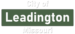 A green sign that says city of leadington missouri on it.