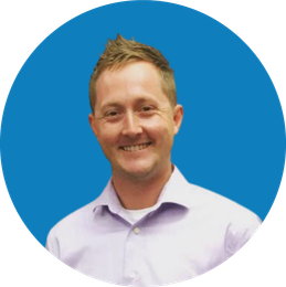 Portrait of a smiling man in a light shirt against a blue circular background