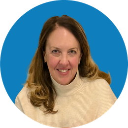 Smiling woman in a cream sweater against a blue circular background
