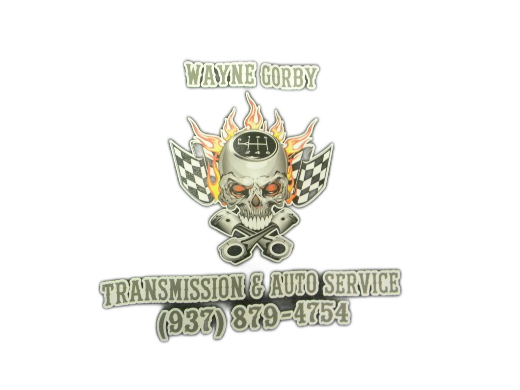 Logo for Wayne Gorby Transmission & Auto Service, skull with flames and checkered flags, phone number (937) 879-4754.