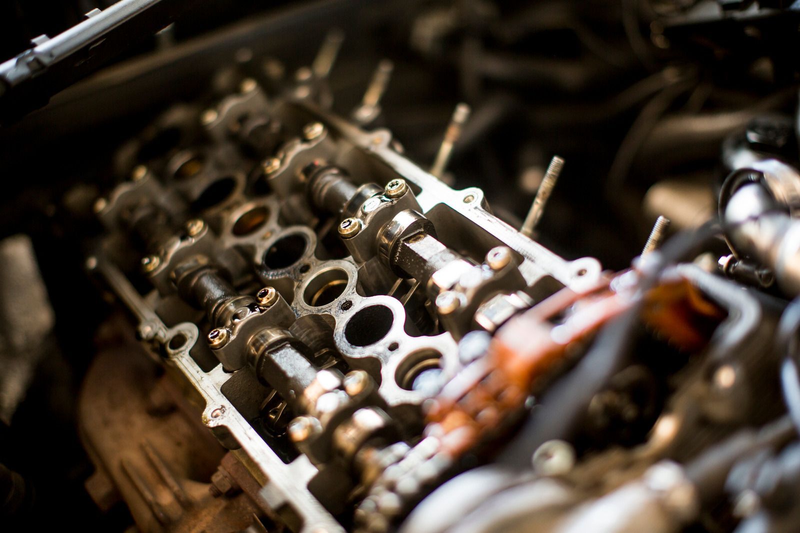 Engine cylinder head with camshafts exposed, open for repair.
