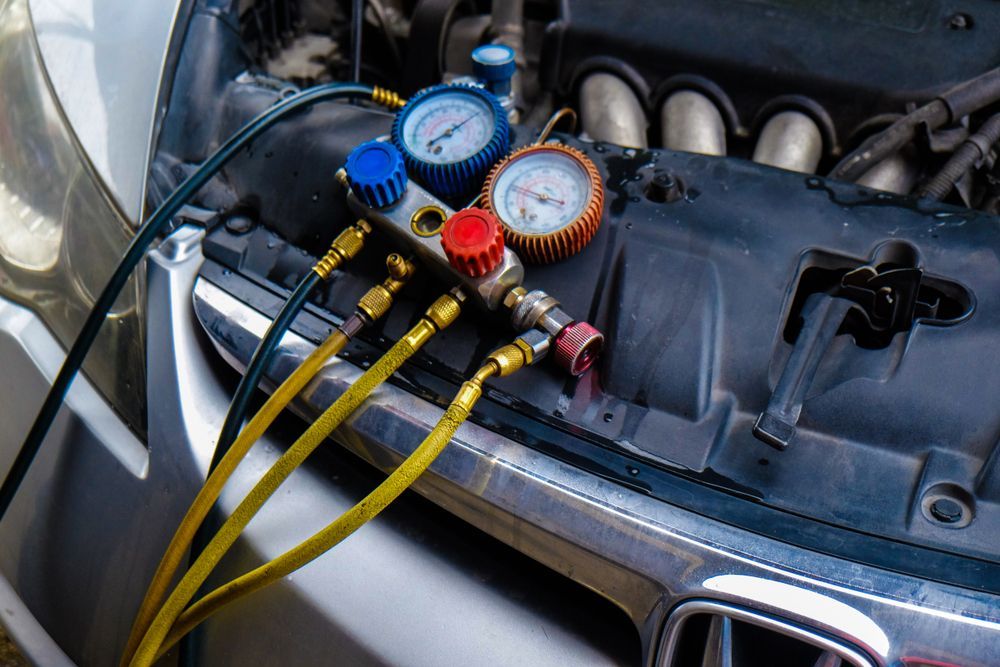 A Close Up of a Car Engine With Gauges Attached to It — Auto Blue Service Centre In Bungalow, QLD