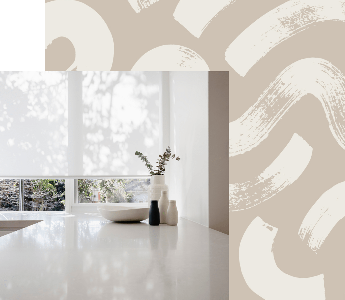 White roller blinds half-drawn over a kitchen window