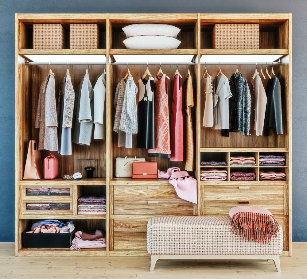 Wooden Wardrobe Filled With Clothes — Caprice Cabinets in Coolum Beach, QLD