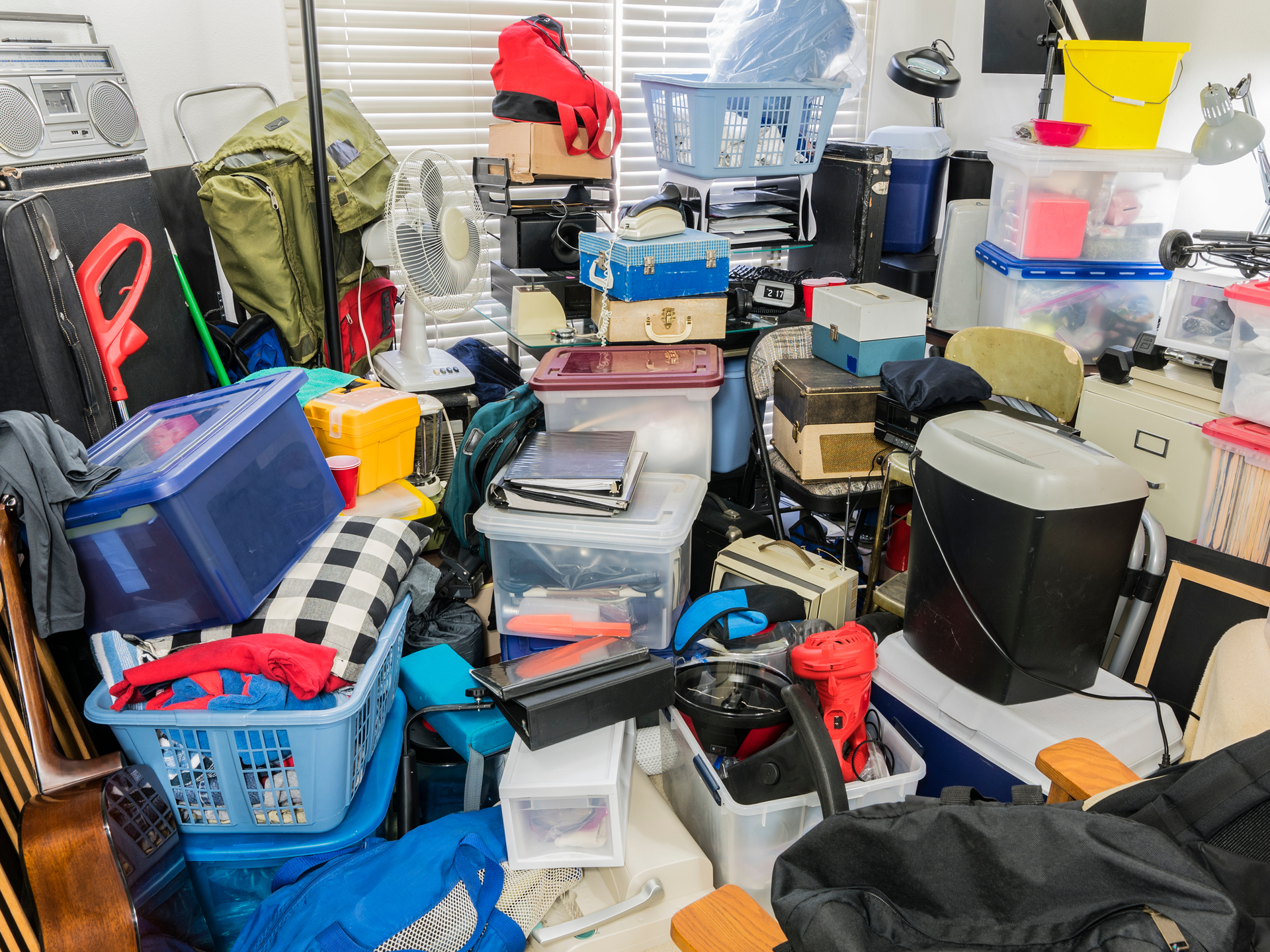 Cluttered room filled with various items, illustrating hoarding cleanup services.
