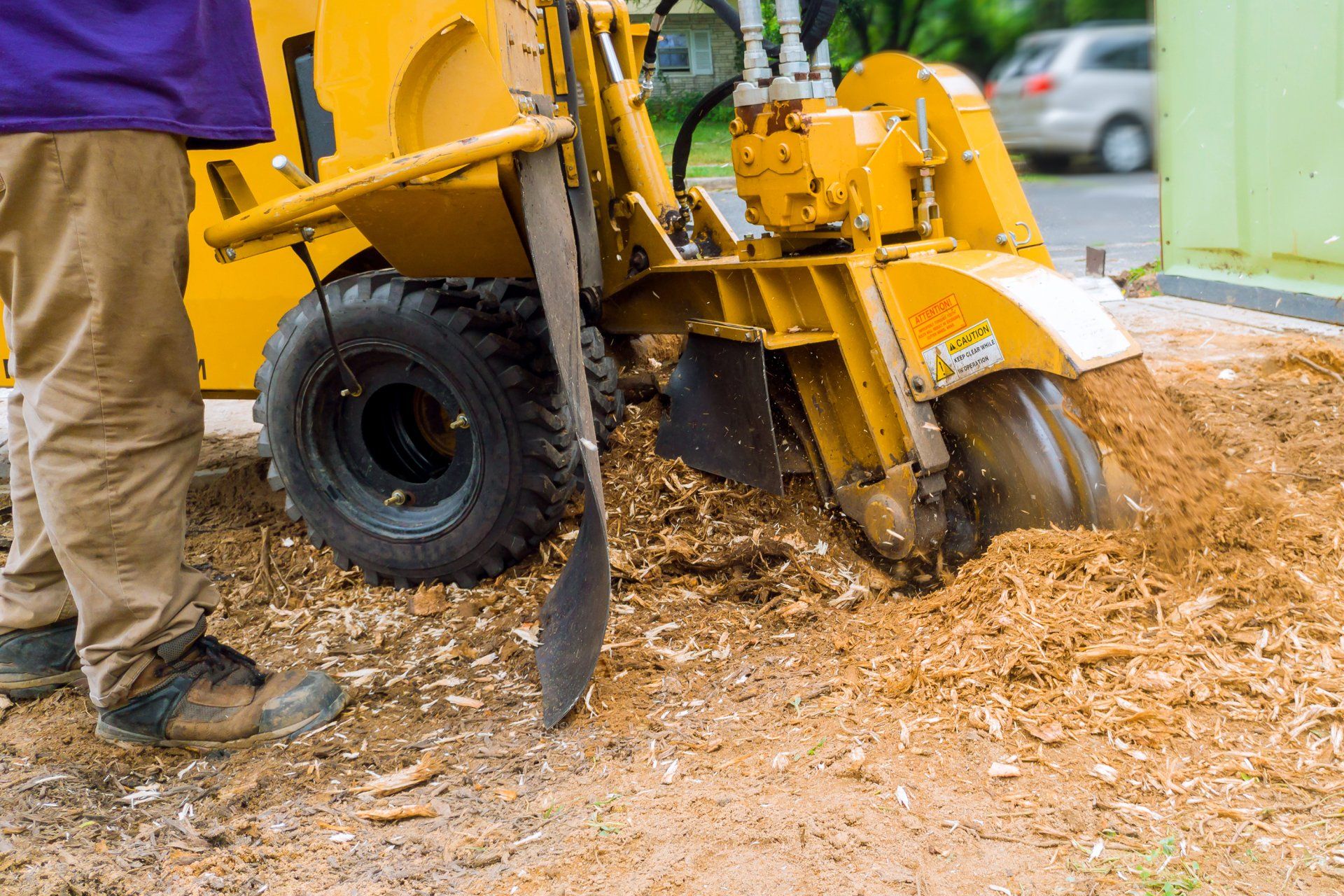 Yellow Machine Removing Tree Stump | Columbus, OH | Campos Tree Services Yellow Machine Removing Tree Stump | Columbus, OH | Campos Tree Services