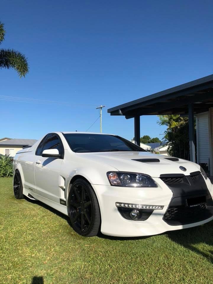 A White Sports Car Is Parked In Front Of A House — Advanced Windscreens & Service Centre In Proserpine, QLD
