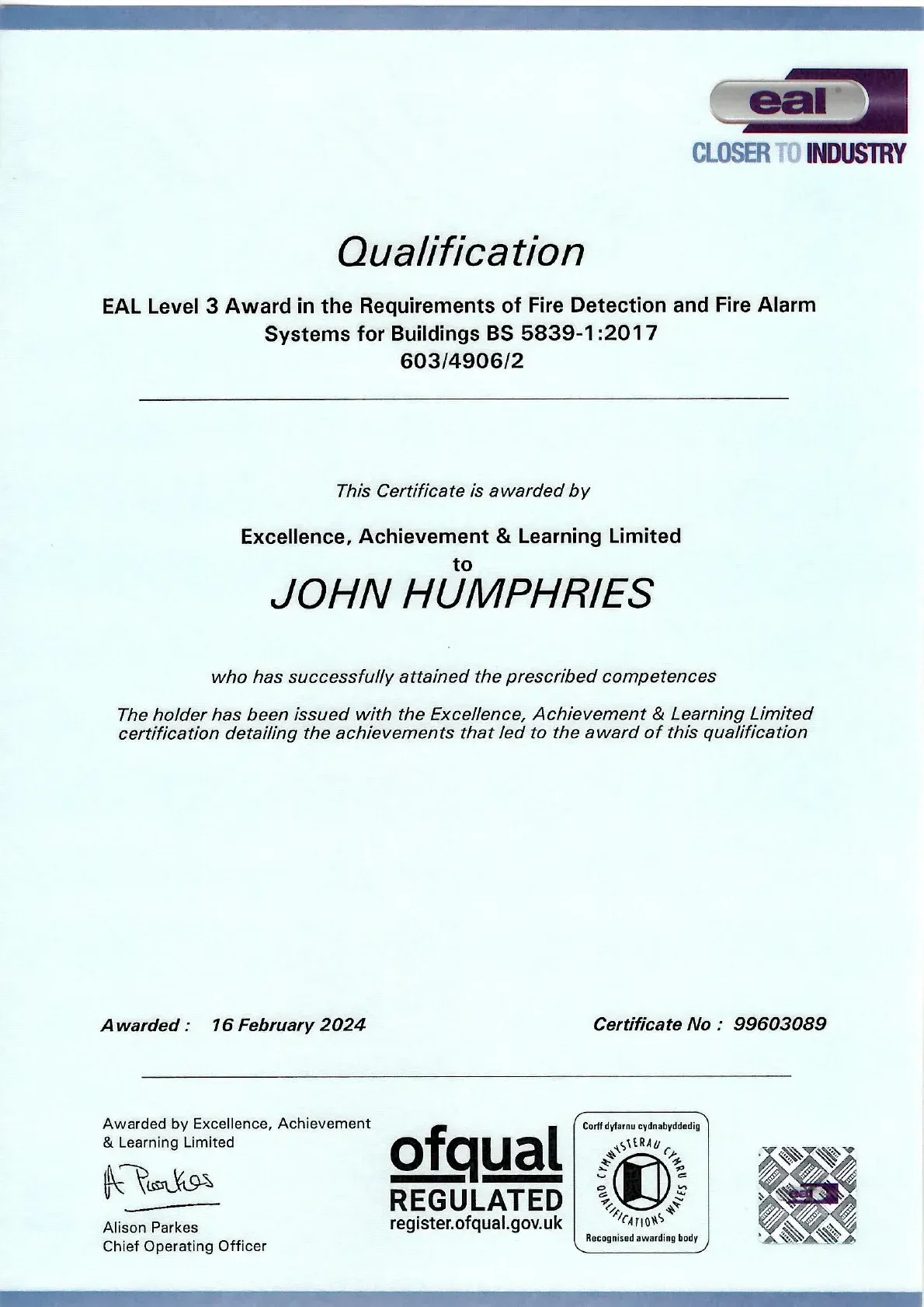 Qualification certificate for John Humphries, with seals and official logos on a pale blue background