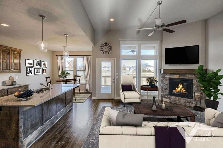 Modern open-concept living room and kitchen with fireplace, island seating, and wall-mounted TV