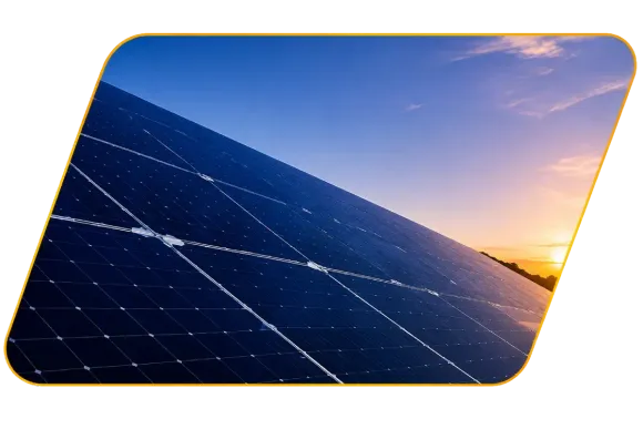 Solar panels at sunset with blue sky and warm orange light