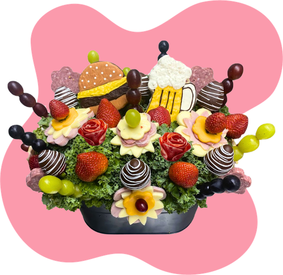 A bouquet of fruit and chocolate covered ghosts in a mug