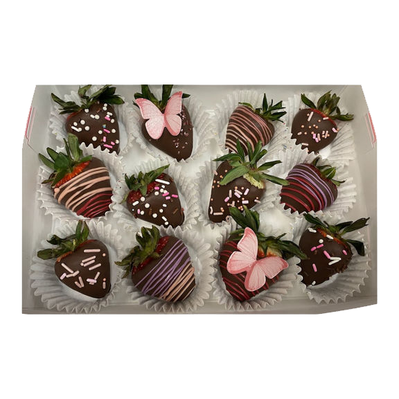 A box of chocolate covered strawberries with sprinkles on them