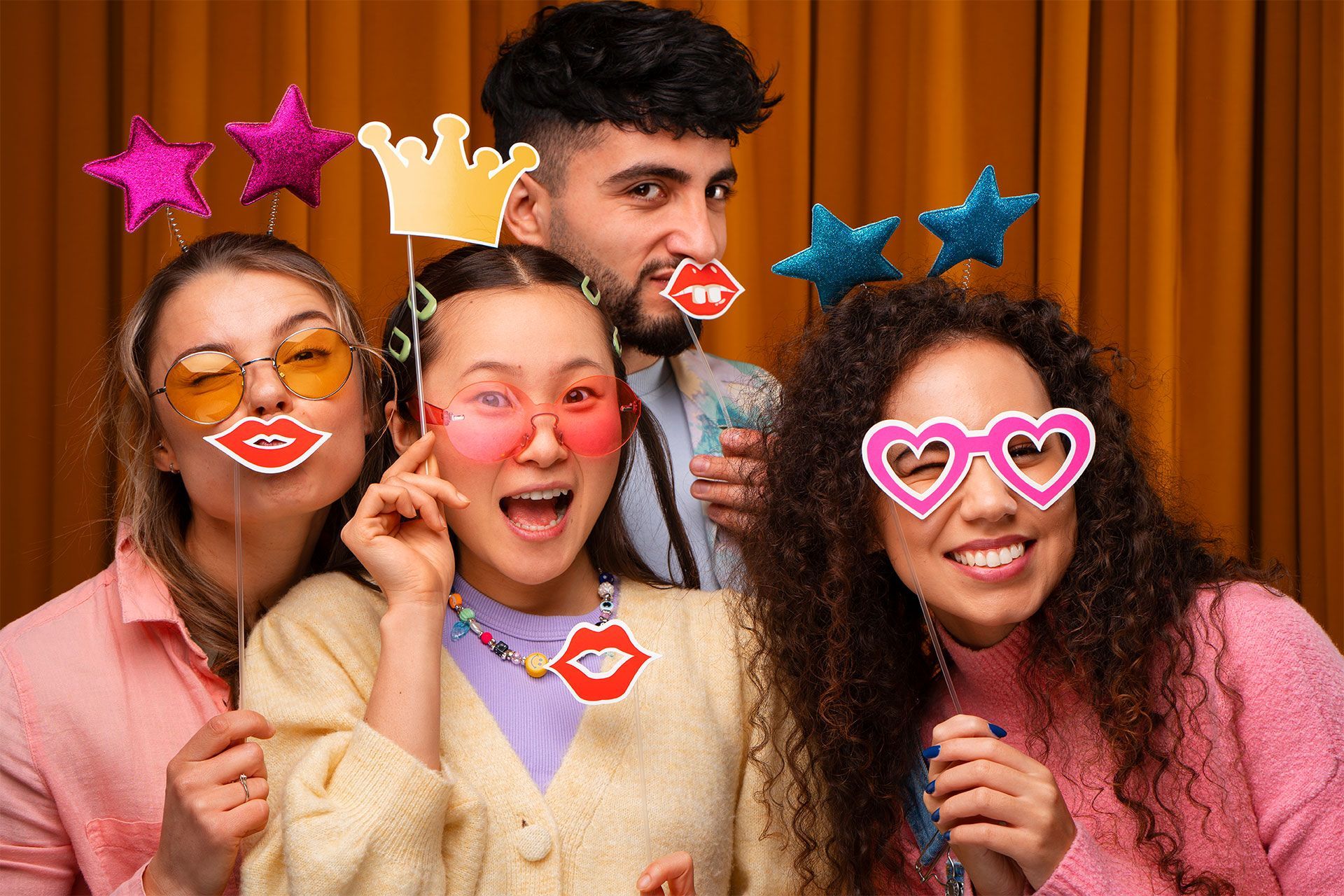 group photo of friends inside the photobooth
