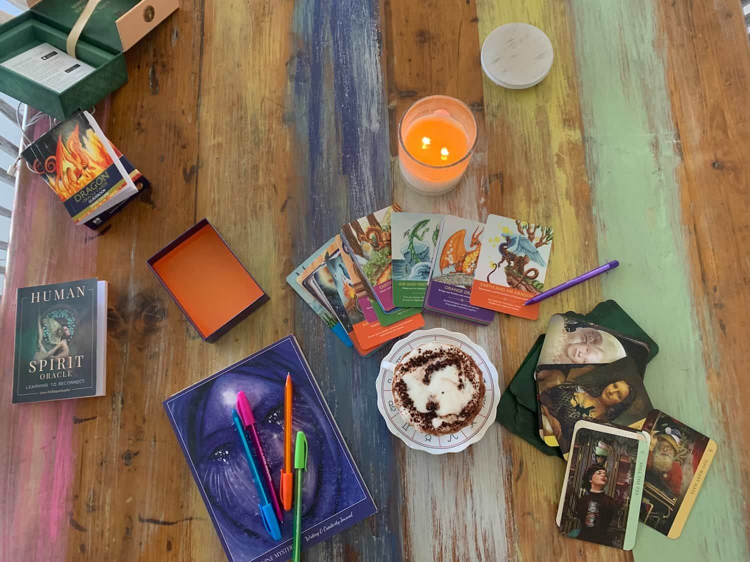 A Wooden Table With Tarot Cards And A Candle On It — My Energetic Craft In Morisset, NSW 