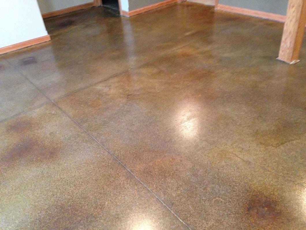 Polished concrete floor with brown and gold tones.