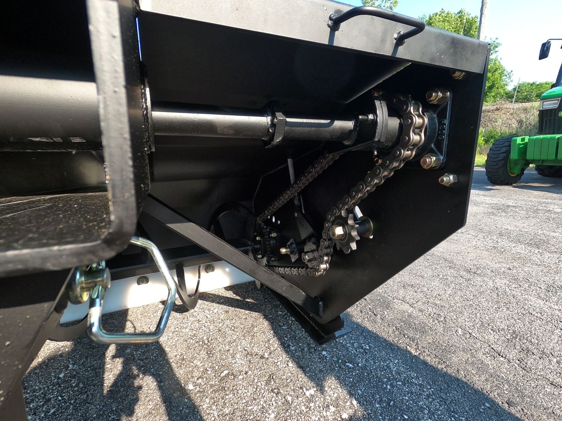Black machinery with a chain and sprocket mechanism