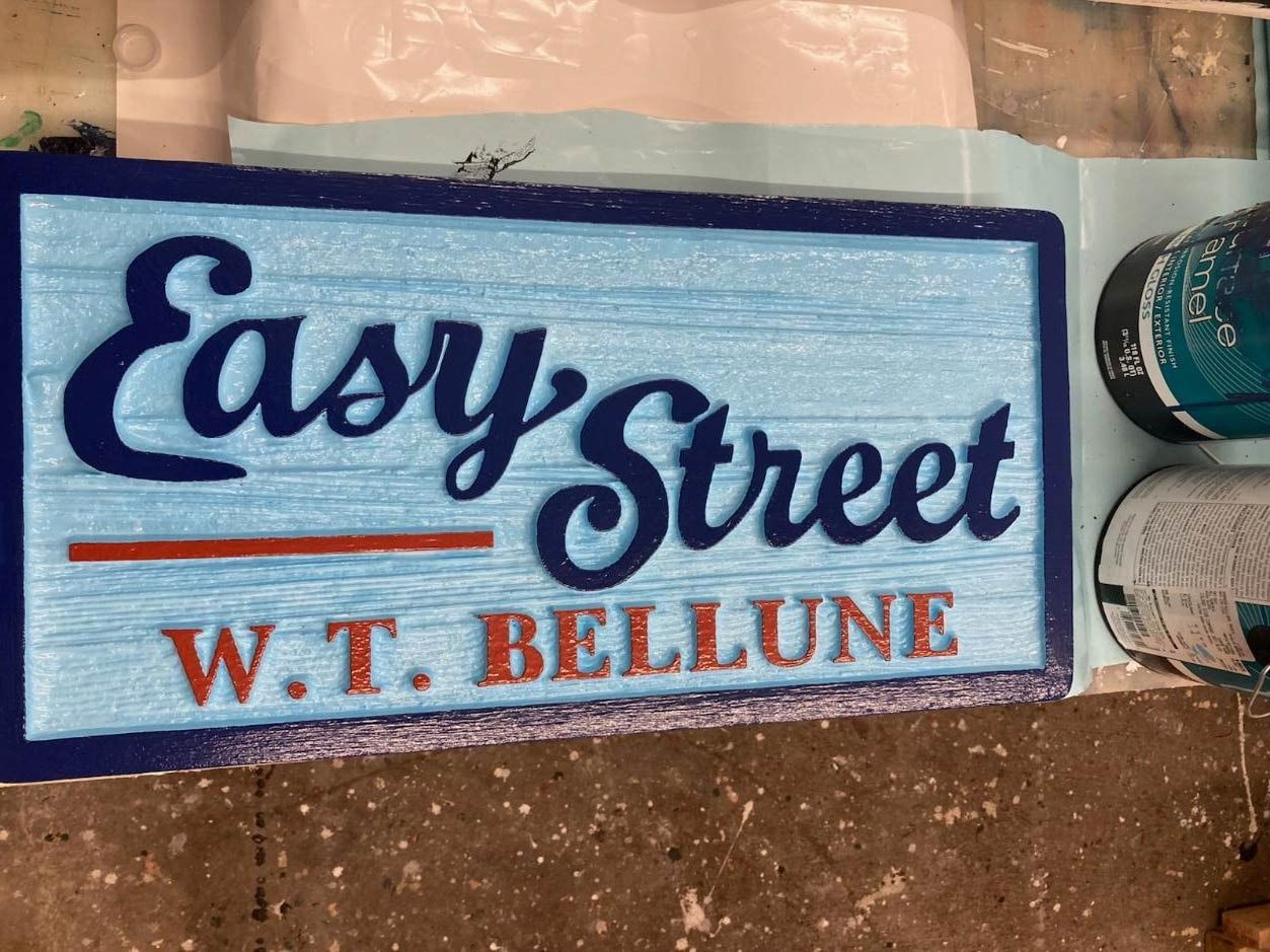 Easy Street W.T. Bellune sign in blue and red on a light background