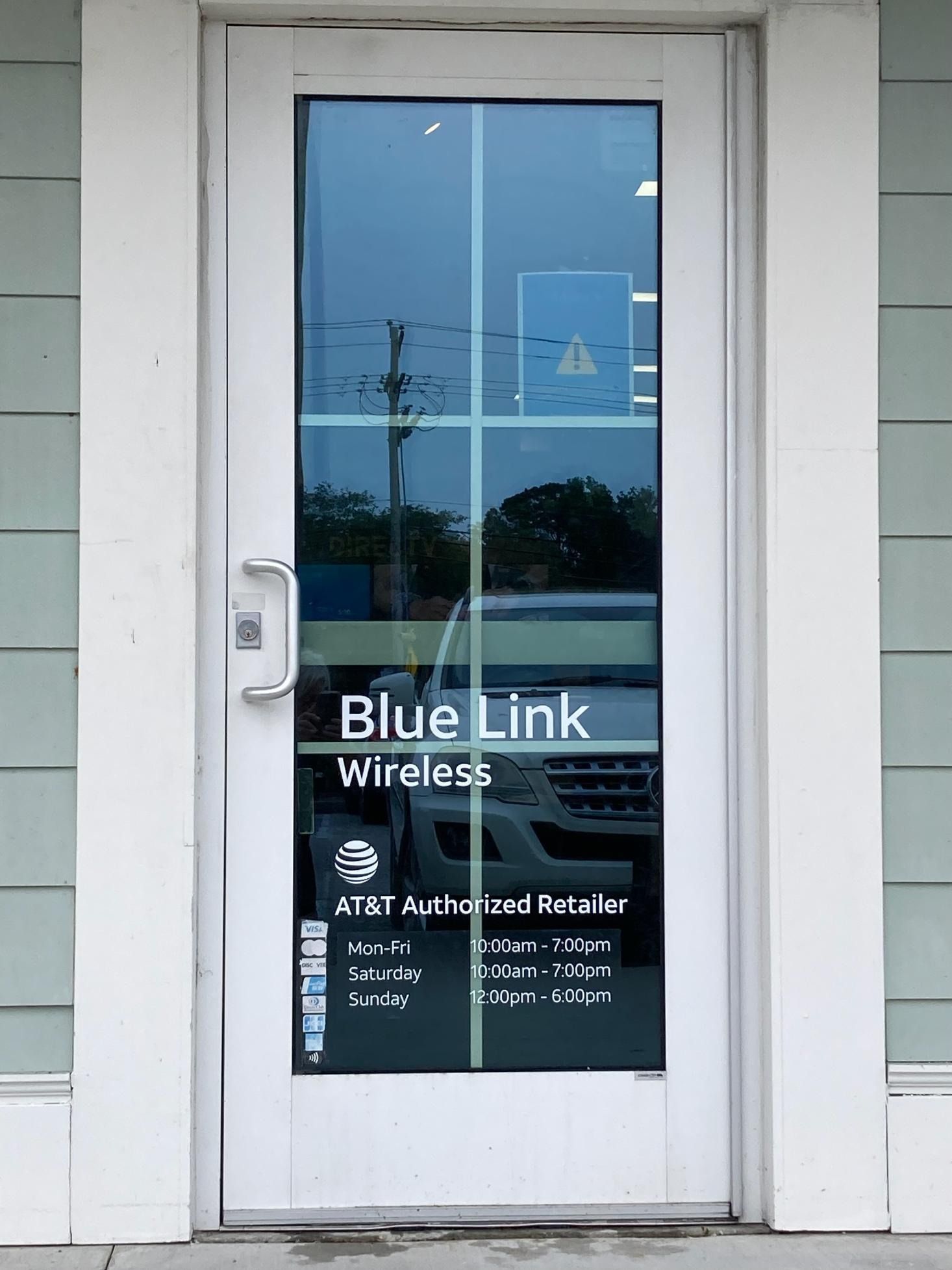 Blue Link Wireless storefront door with business signage and AT&T Authorized Retailer text