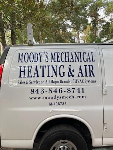 Moody’s Mechanical Heating & Air van with company logo, phone number, and website on the side