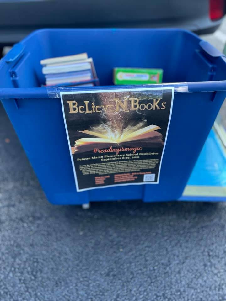 Blue bin of books with 