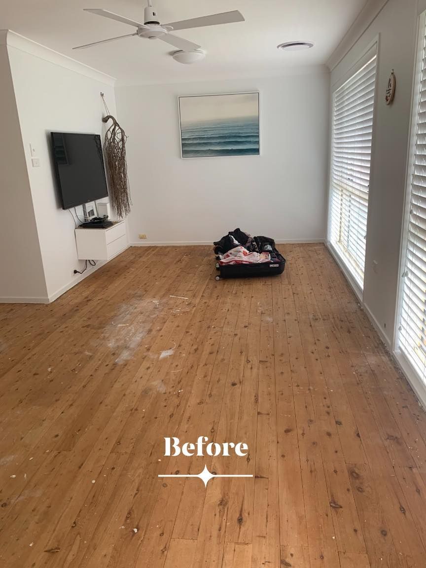 A Room With Light Wood Floors and White Walls — Custom Floor Sanding In Somersby, NSW