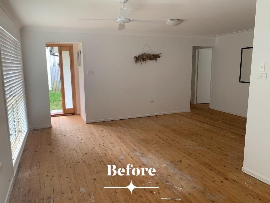 Empty Living Room With Light Wooden Floors and White Walls — Custom Floor Sanding In Somersby, NSW