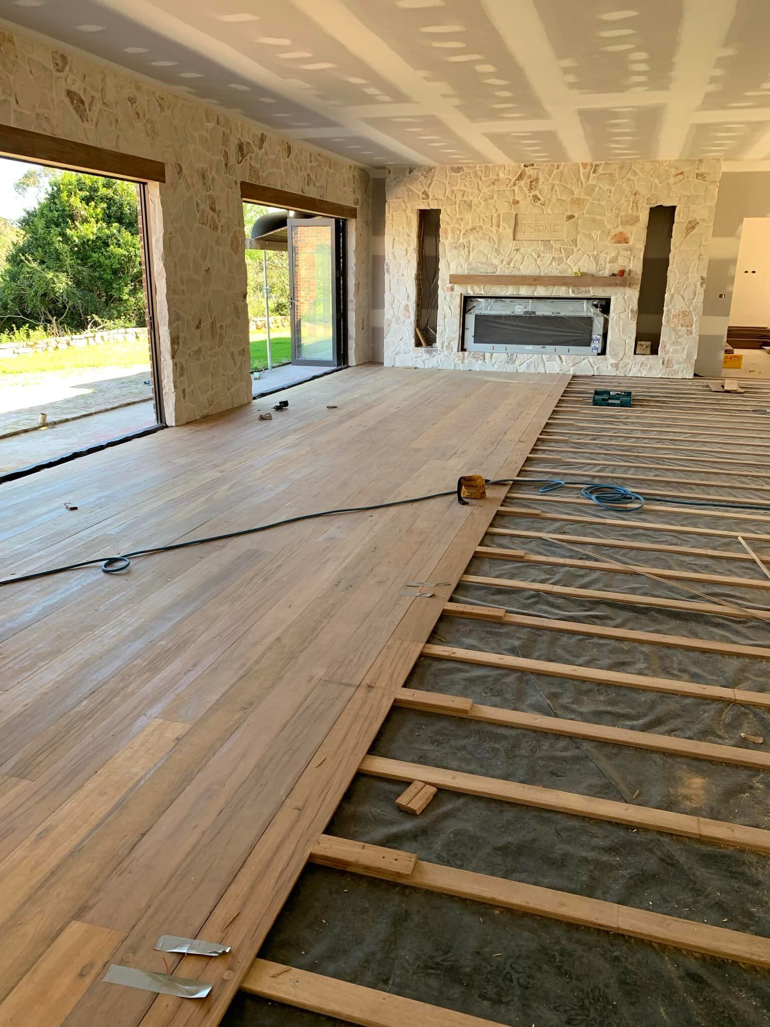 Wooden Floor Installation in Progress Indoors — Custom Floor Sanding In Somersby, NSW