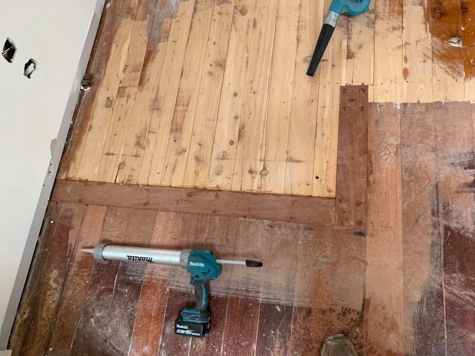 Wood Floor Being Repaired With a Power Tool — Custom Floor Sanding In Somersby, NSW