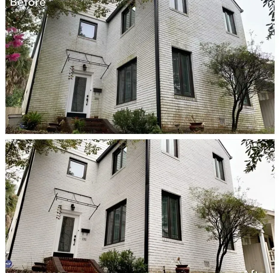 Before and after: Two-story white brick house, cleaned. The before picture shows green growth. The after is clean.