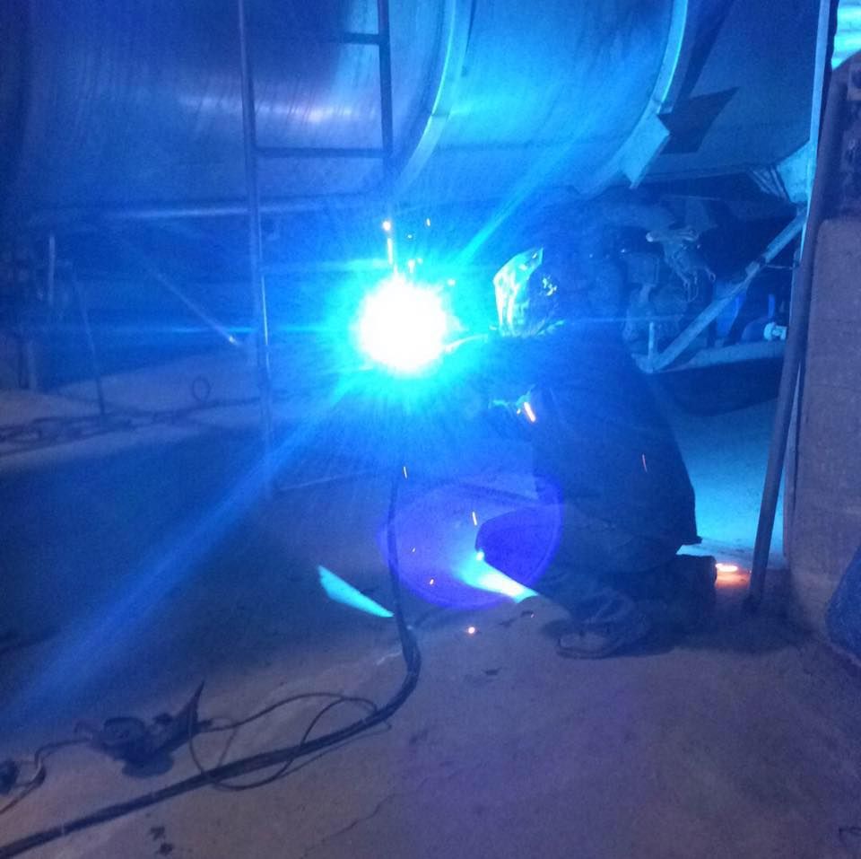 a welder fixing a trailer