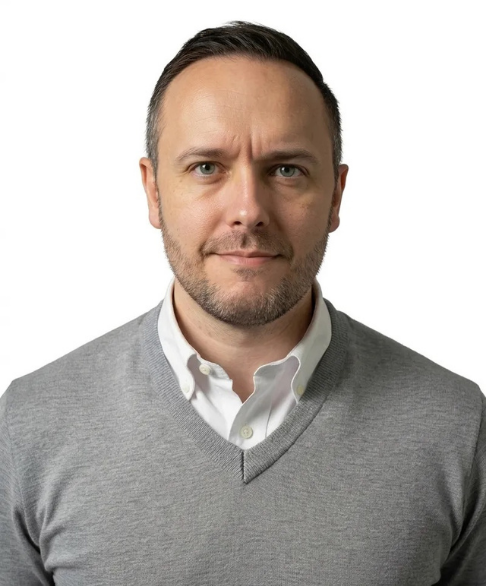 A person with short hair and light stubble looking directly at the camera against a circular, bright green background.