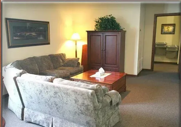 A living room with a couch and a coffee table