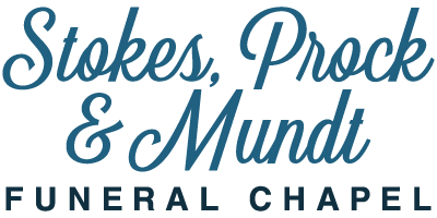 The logo for stokes prock & mundt funeral chapel is blue and white.