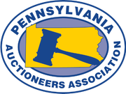 Logo for the Pennsylvania Auctioneers Association featuring a blue gavel superimposed over a yellow map of Pennsylvania.