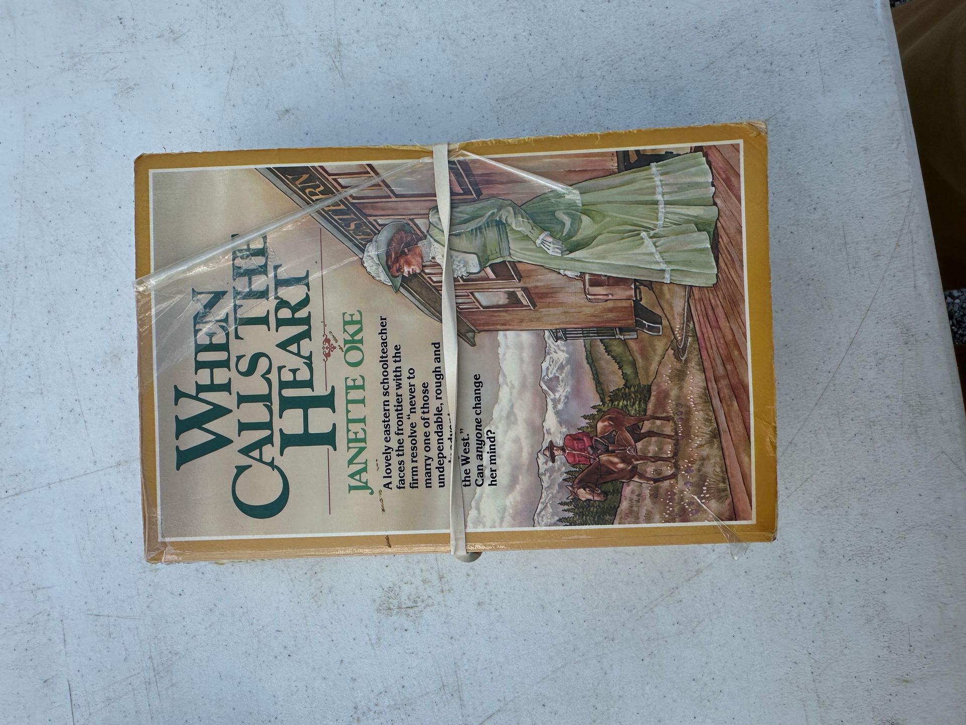 Cover of a “What on Earth Happened?” book lying on a gray surface, split by a white strap.